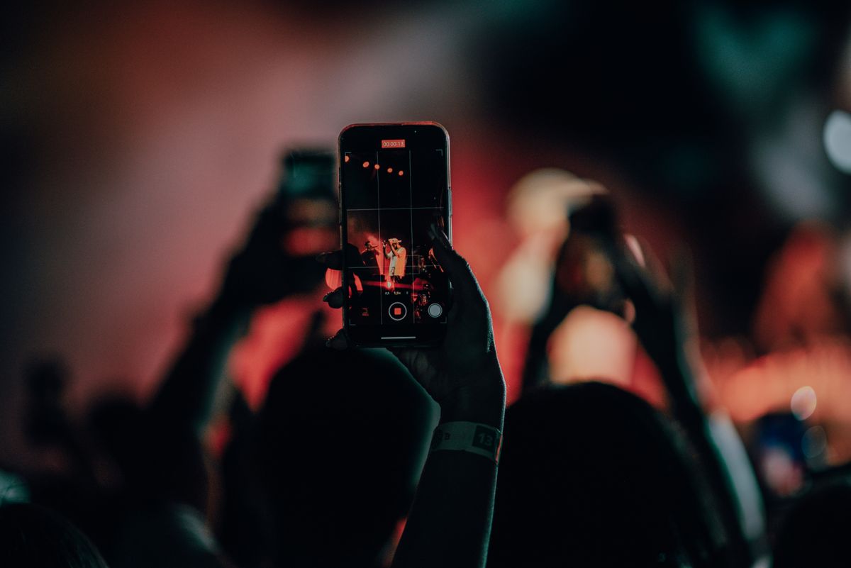 Person Recording Concert on Smartphone · Free Stock Photo