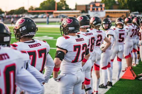 Free High school football players in white uniforms preparing for a game in Idaho Falls. Stock Photo