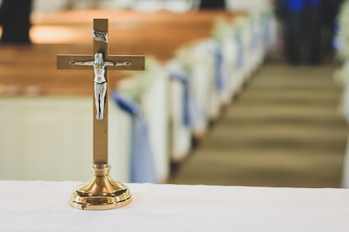 Free Brown and Silver Cross Table Decor Stock Photo