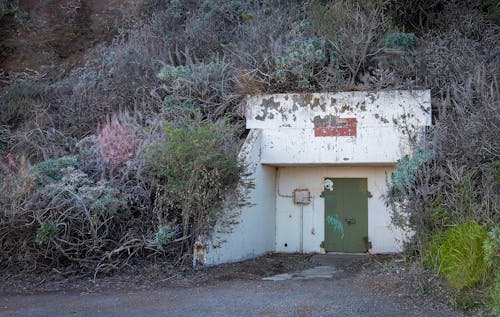 Abandoned Bunker with Green Door