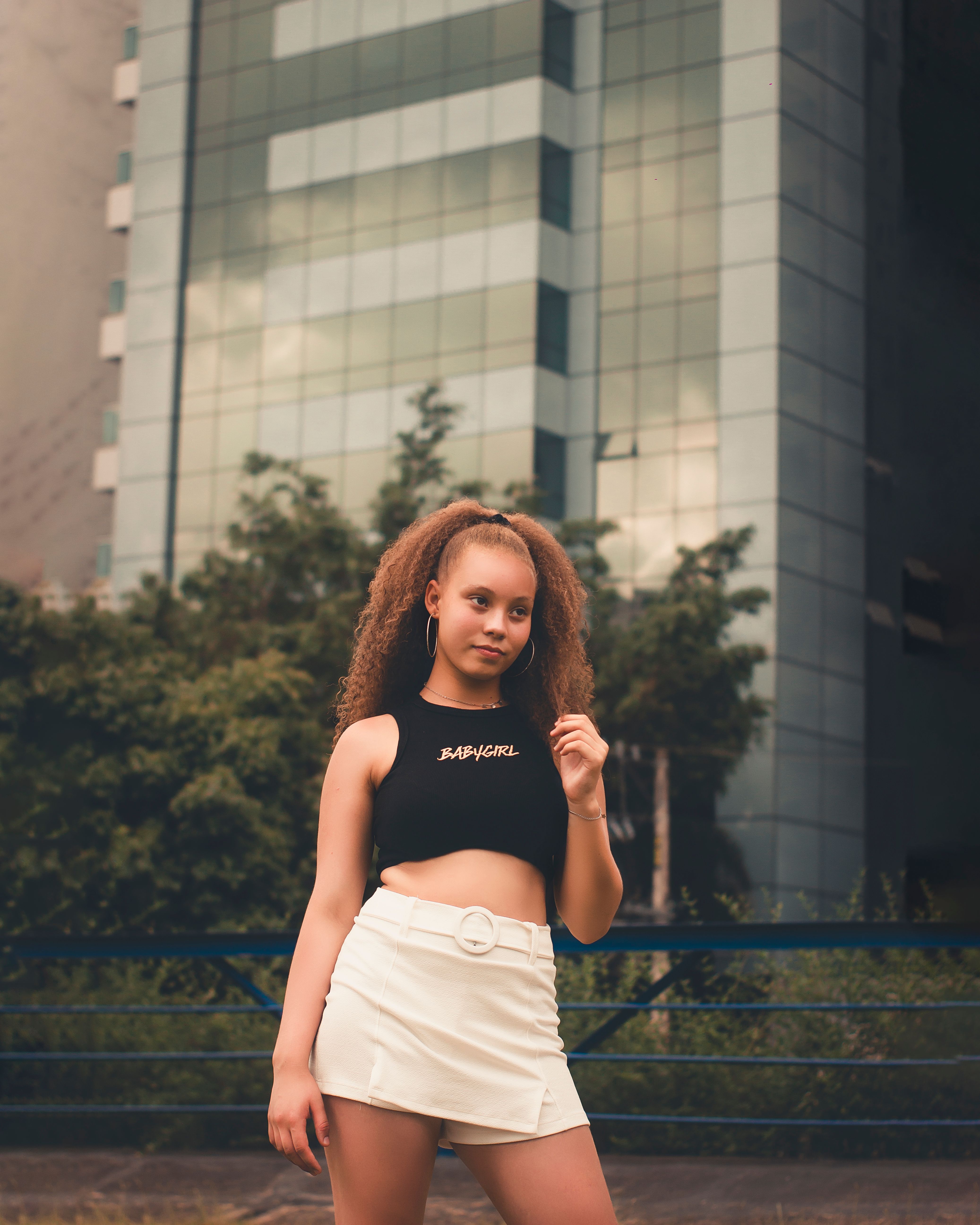 A Brown-Haired Woman in Black Crop Top and White Skirt · Free Stock Photo