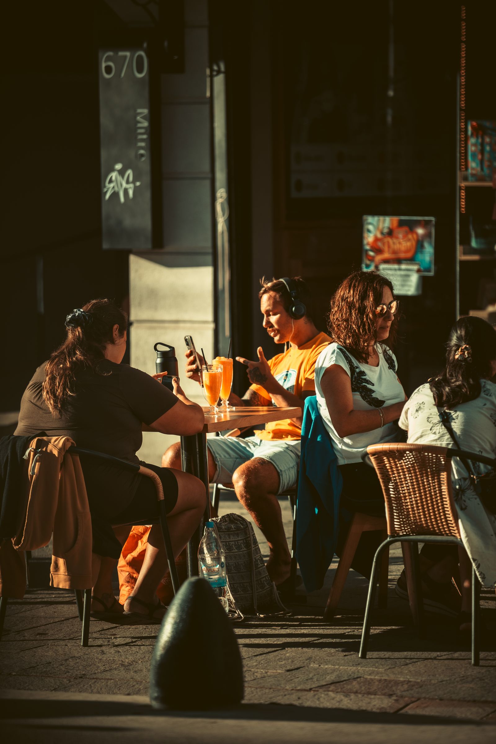 Coastal social dining atmosphere, warm golden light