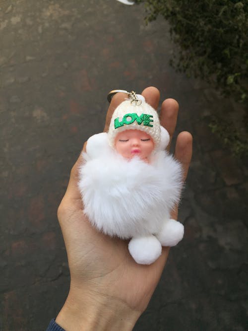 Free Cute Doll in Hand Stock Photo