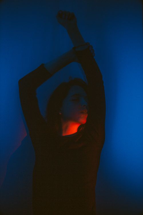 Free Artistic photo of a woman posed with dramatic blue and red lighting in Kyiv. Stock Photo