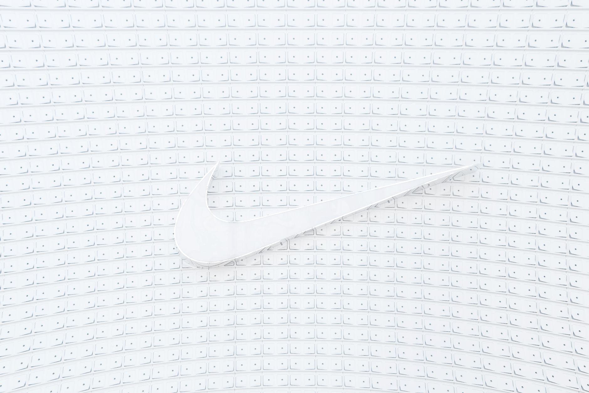 手機品牌Logo露出規範:遮擋與替換實用指南 Elegant white logo displayed on a textured, geometric white background with cubes. Ideal for modern design and branding concepts.