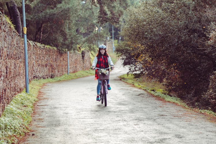 Photo Of A Woman Riding A Bike