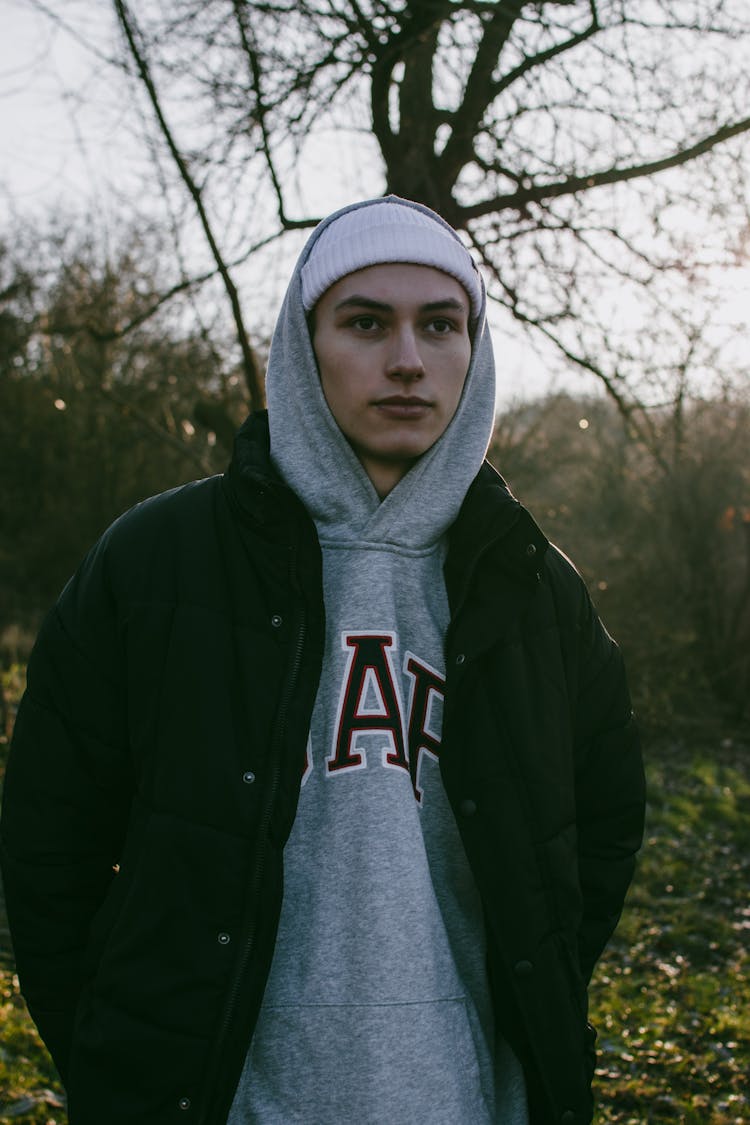 Man Wearing Hood Over Hat