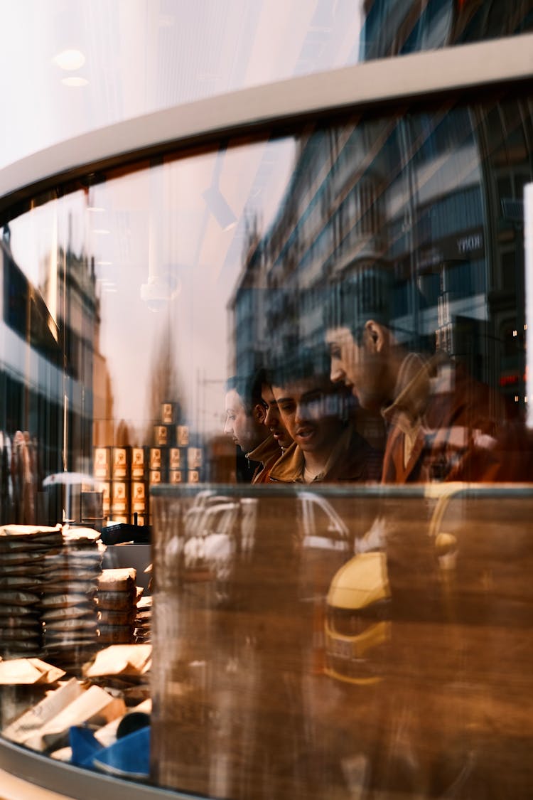 Abstract Image Of A Reflection In A Window, And Men In The Bar