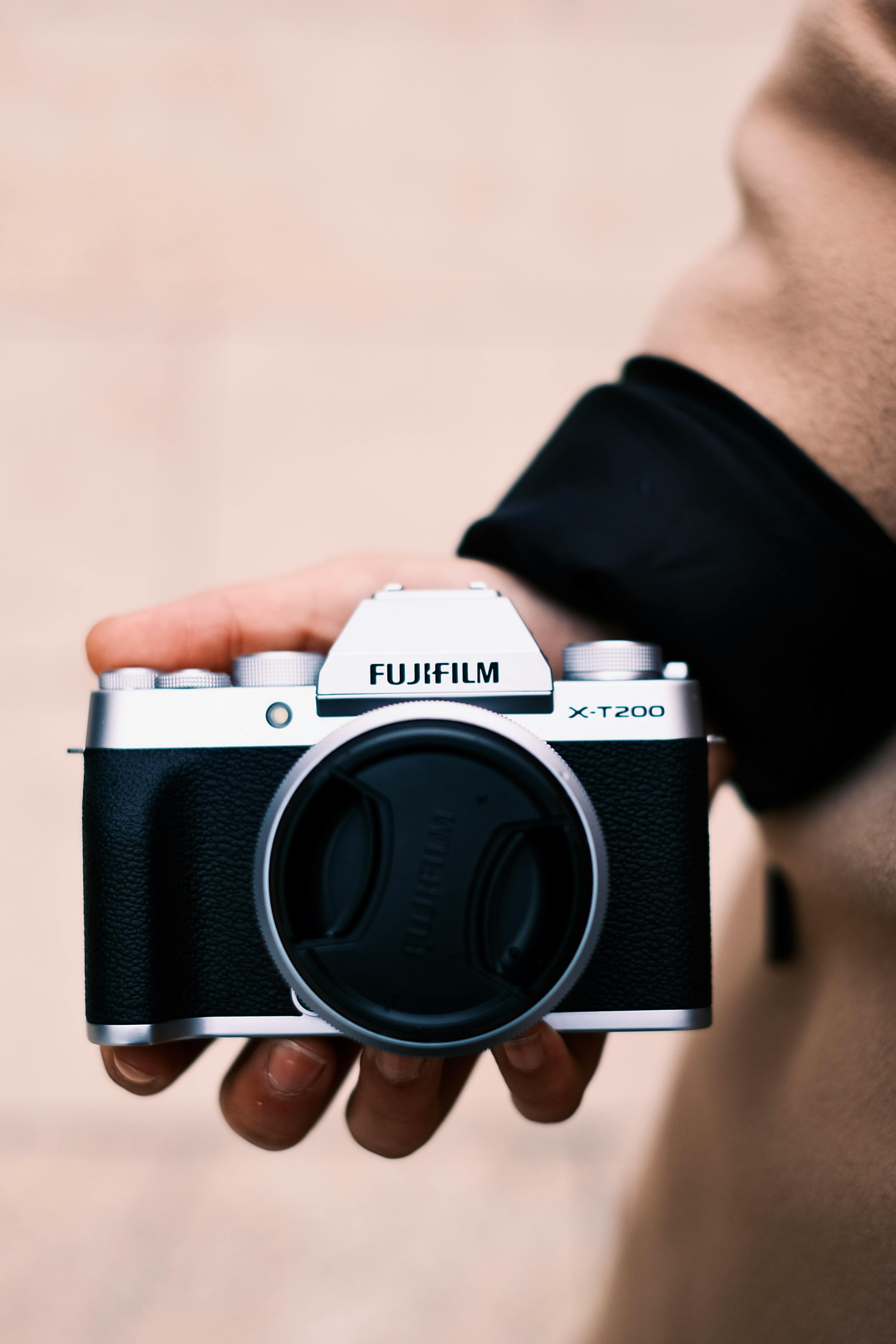 Hand Holding a Fujifilm X-T-200 Camera · Free Stock Photo