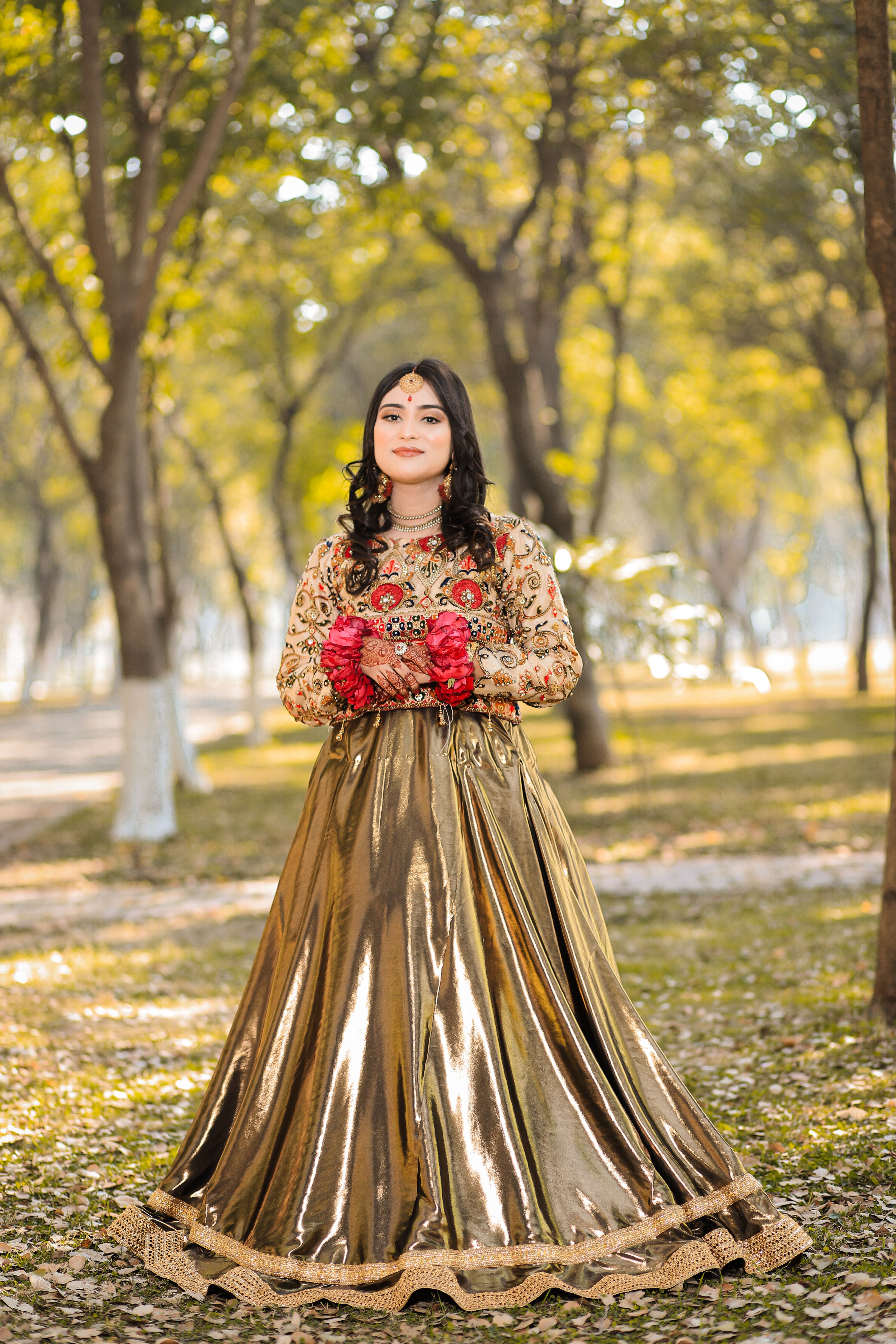 Smiling Woman in Traditional Clothing at Park · Free Stock Photo