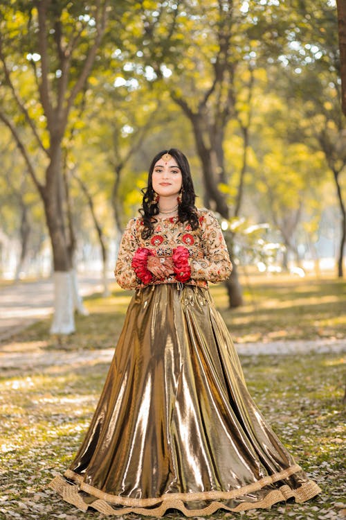 Woman in Traditional Clothing at Park