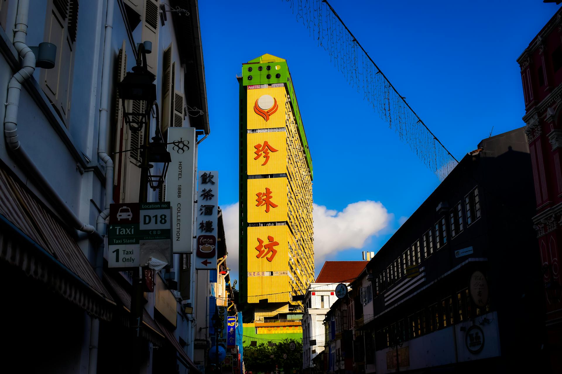 Yellow Mural among Buildings in Singapore