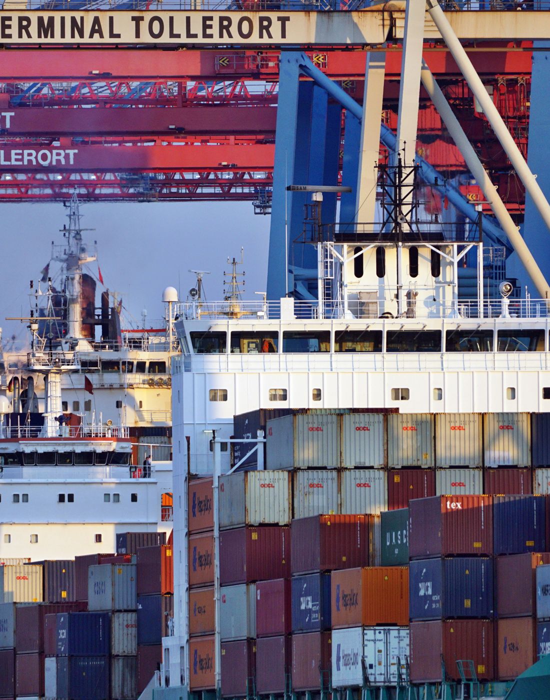 Container ships at a harbor during sunset
