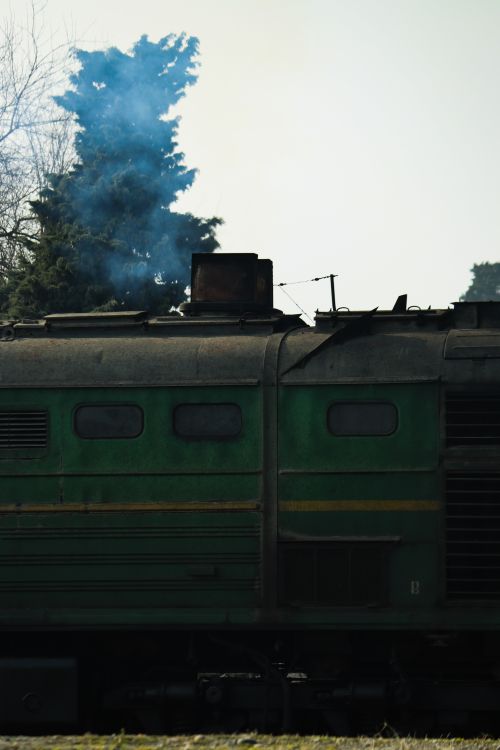 Free Old green diesel locomotive with smoke in Lankaran, Azerbaijan. Stock Photo