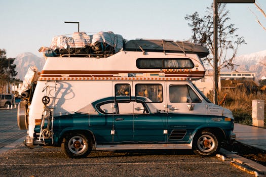 Retro camper van loaded for adventure, basking in warm sunset lighting.