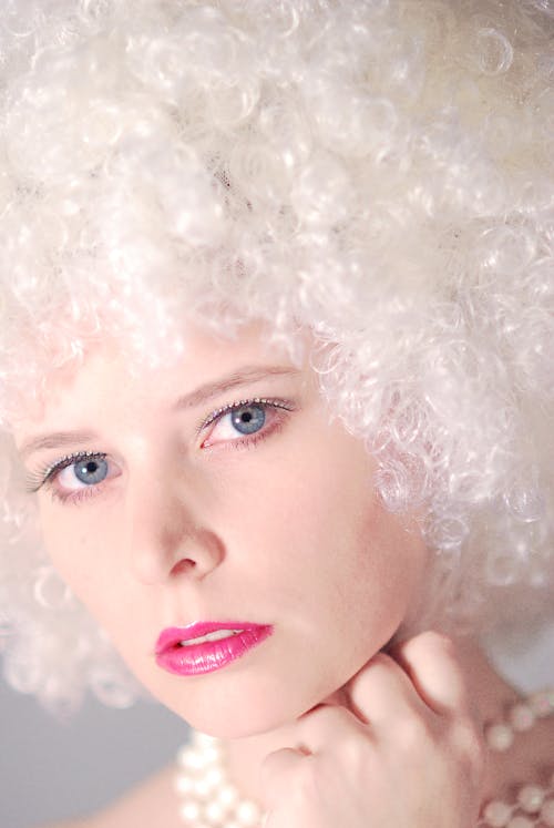 Portrait of a Pretty Woman with White Curly Hair