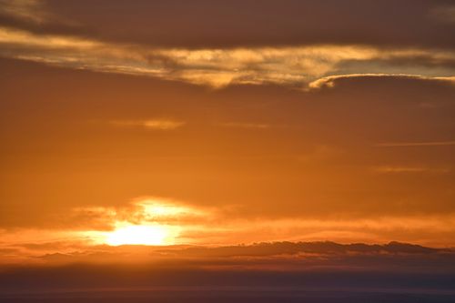 Free Stunning sunrise with golden hues and clouds over Stone Mountain, Georgia. Stock Photo