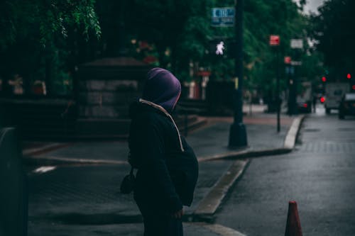 Woman Standing Near Traffic Cone