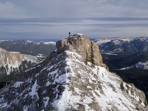 People Climbing Mountains in Winter