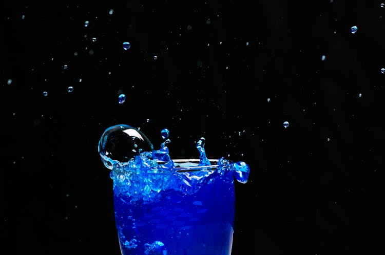 Blue Liquid Splash On Glass