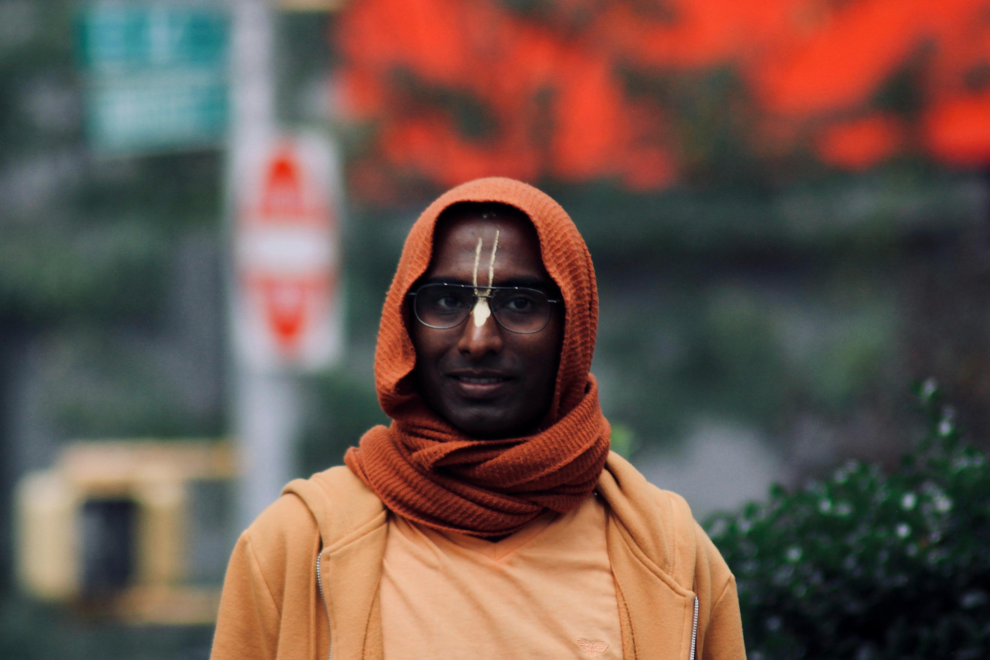 Man Standing Near Green Leafed Plants