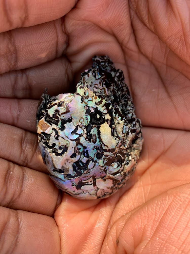 Colorful Broken Stone On A Person's Hands