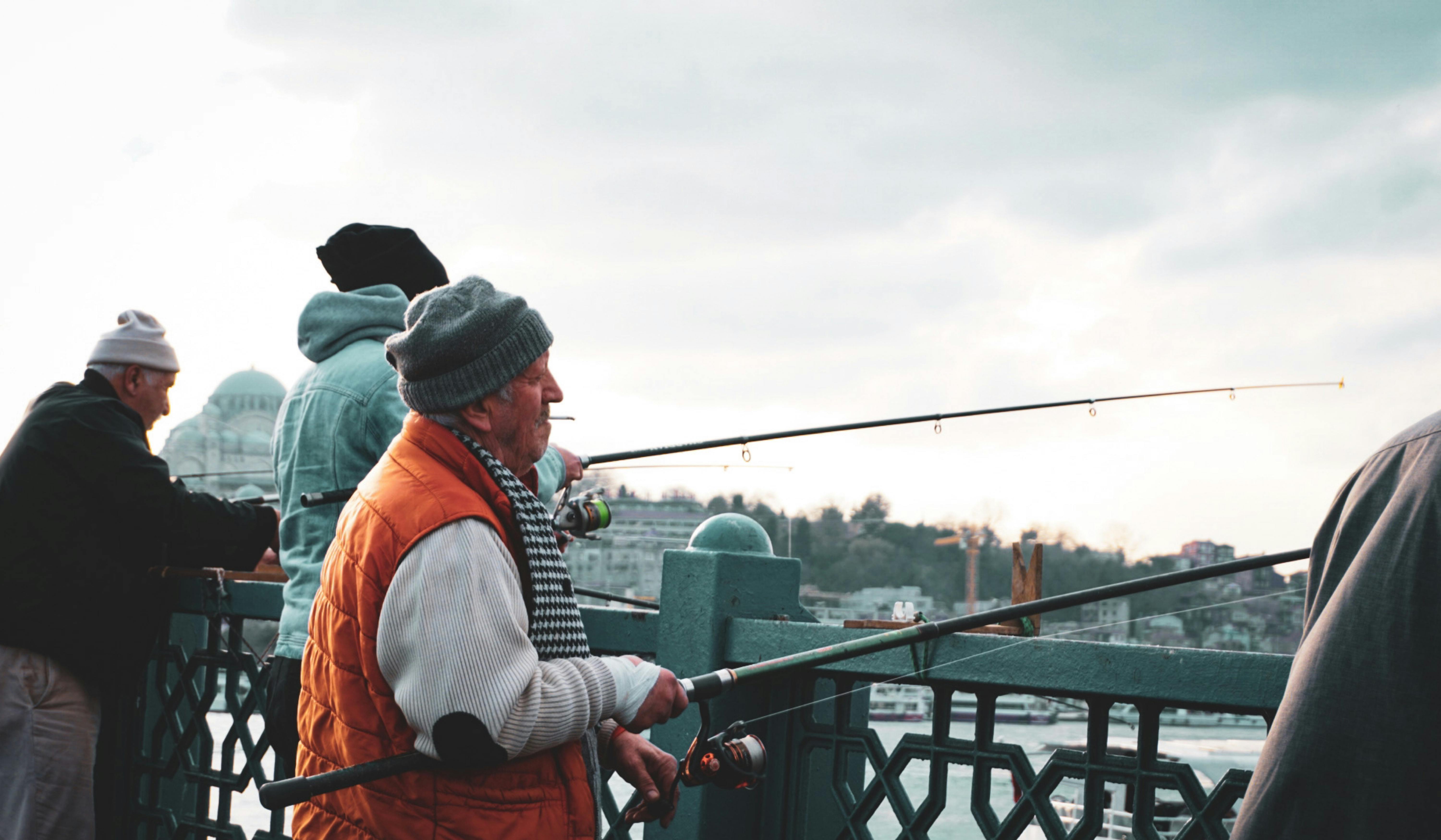 Men with Fishing Rods on a Bridge in Istanbul · Free Stock Photo