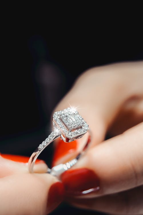 Close-Up Photo of Person holding Diamond Ring