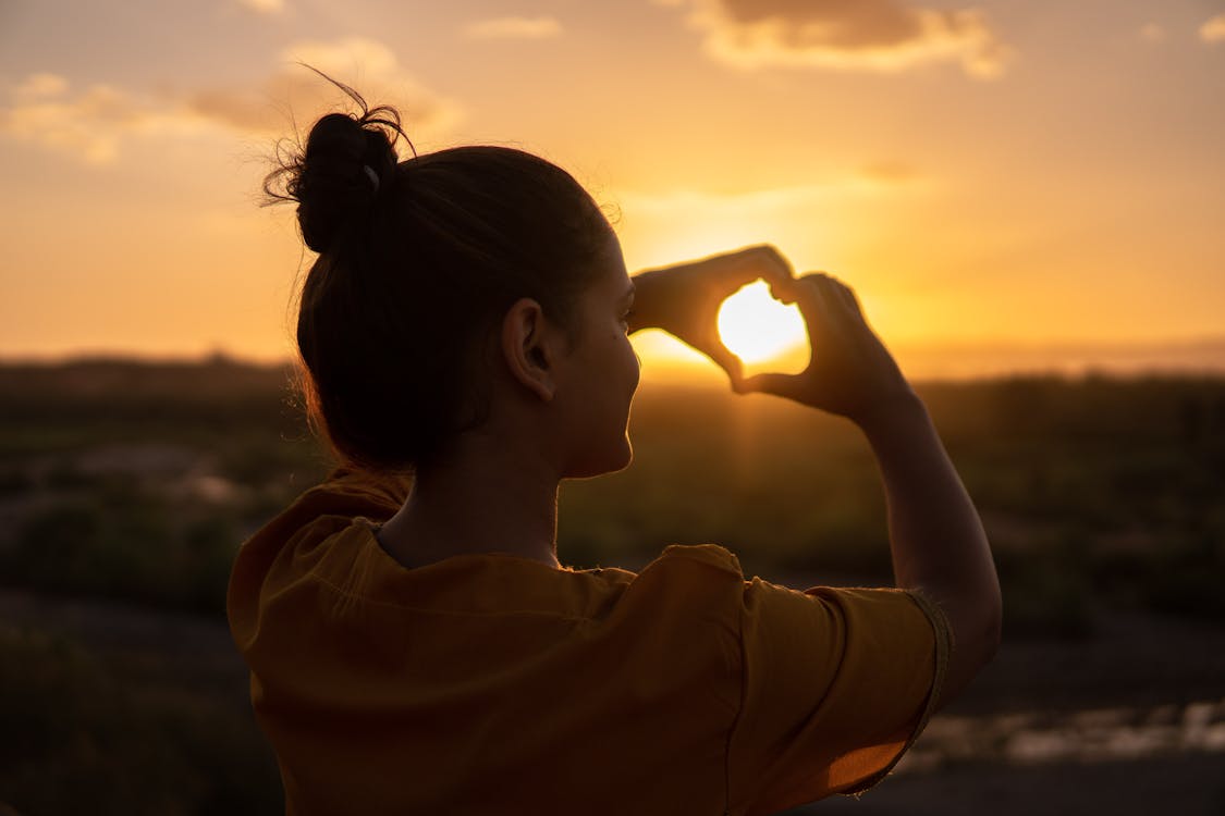 Free Woman Doing Hand Heart Sign Stock Photo