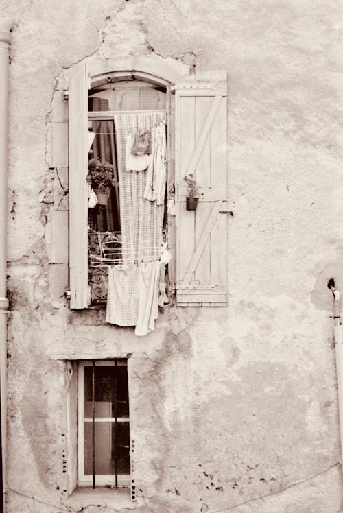 Laundry Hanging from a Window in an Old Building 