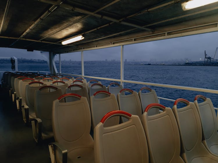 Empty Seats Of A Ferry On A River 