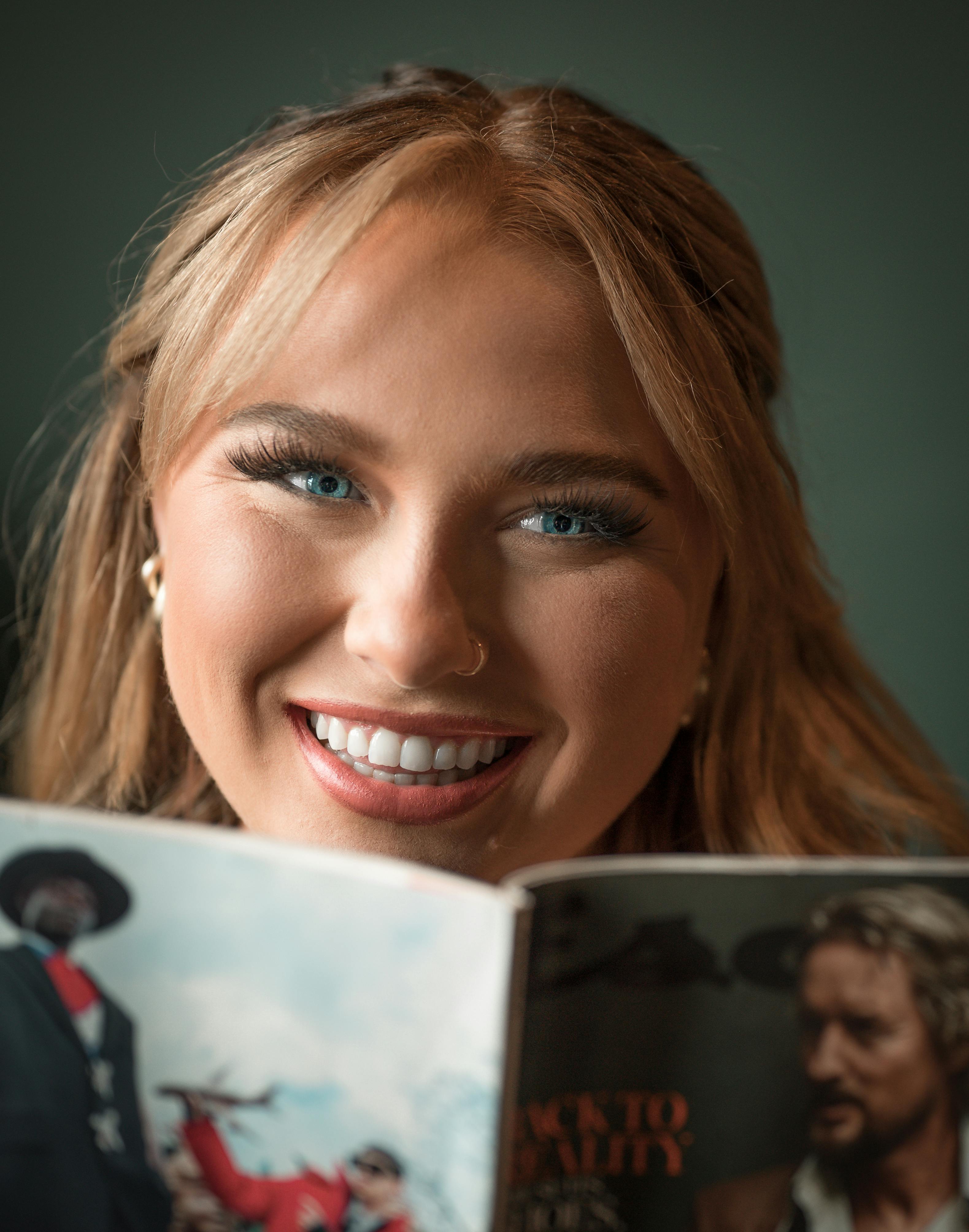 smiling woman reading a book