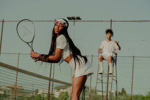 Young Woman Playing Tennis