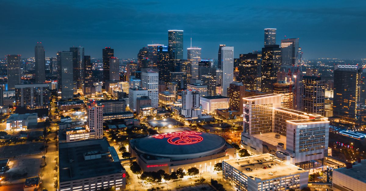 Aerial panorama of downtown Houston, Texas skyline illuminated at night