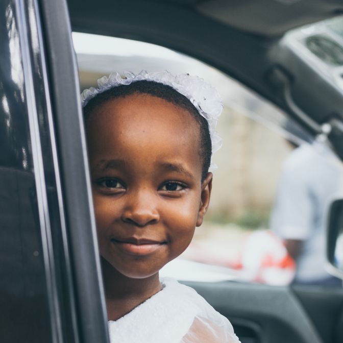 Mother and child sharing a happy moment inside their family car