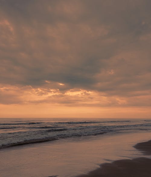 Waves Washing up the Beach at Sunset 