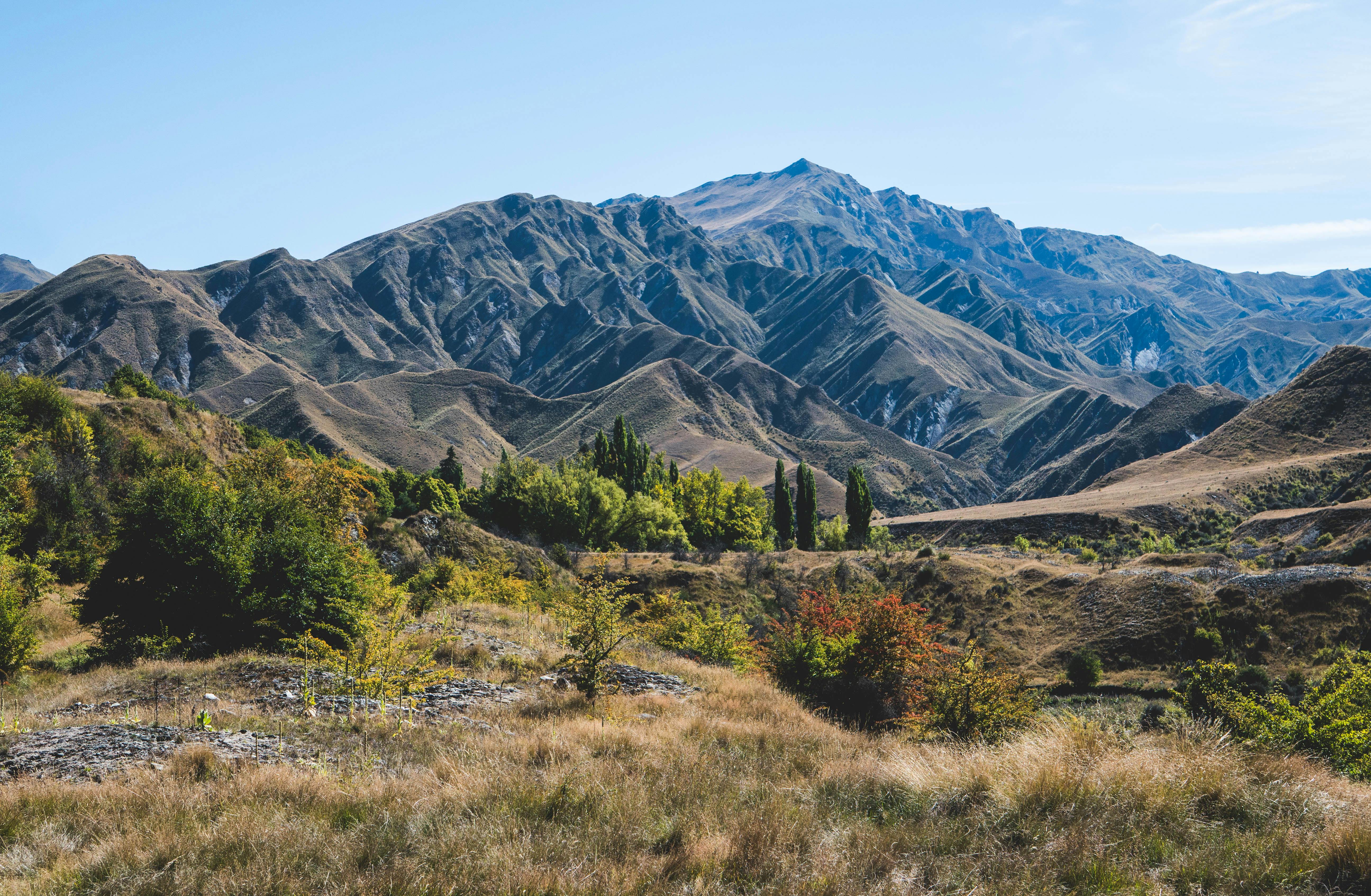 High-mountainous Sharp Rocks Against The Blue Sky And White Clouds.  Caucasus Stock Photo, Picture and Royalty Free Image. Image 87097392.