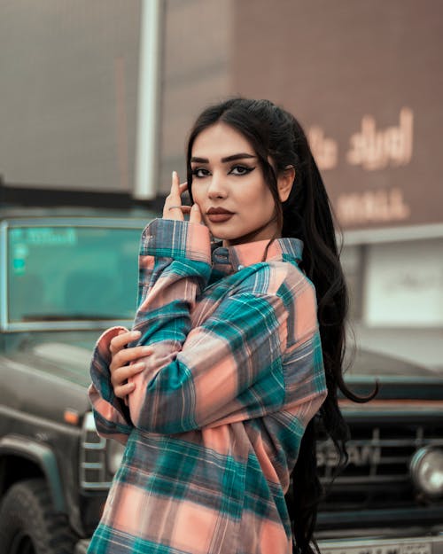 A Beautiful Woman in Plaid Shirt Posing