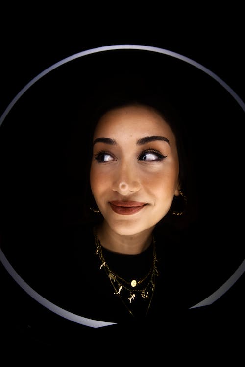 Studio Portrait of a Young Woman Smiling Gently 