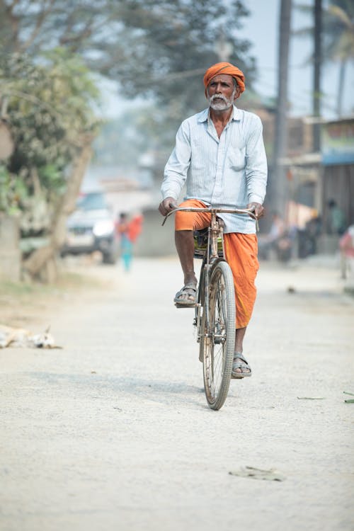 Man in Turban on Dirt Road in Village