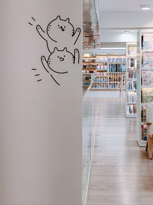 Drawings of Cats on a Wall in a Library 