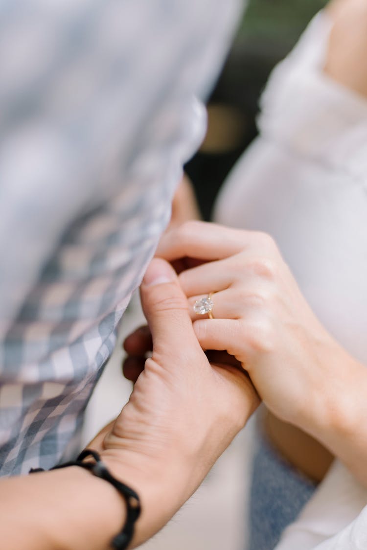 Close-up Of Engaged Couple Holding Hands