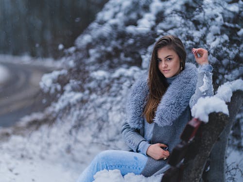Woman Posing on Bench in Winter