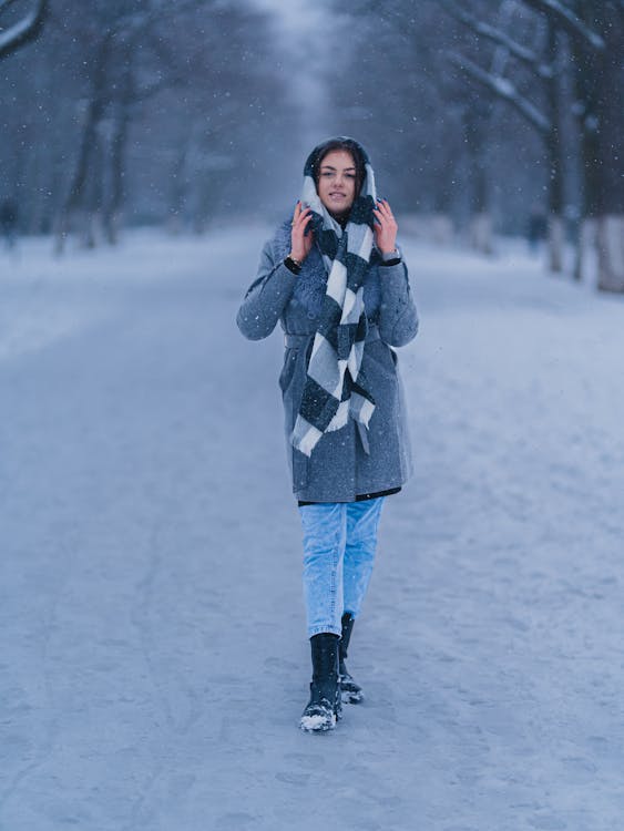 Woman Standing on Walkway in Winter
