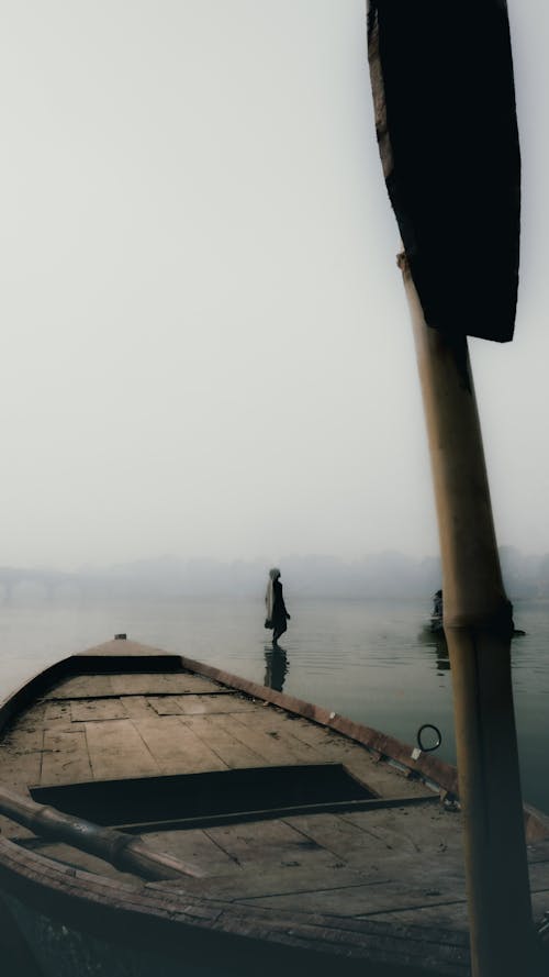 Brown Wooden Boat on Sea