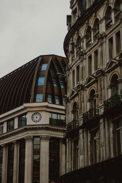 Free Intricate facades of historic buildings in London, showcasing ornate architecture under overcast skies. Stock Photo