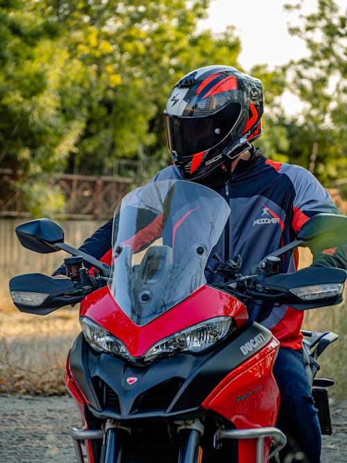 A Person Sitting on a Red Ducati Multistrada