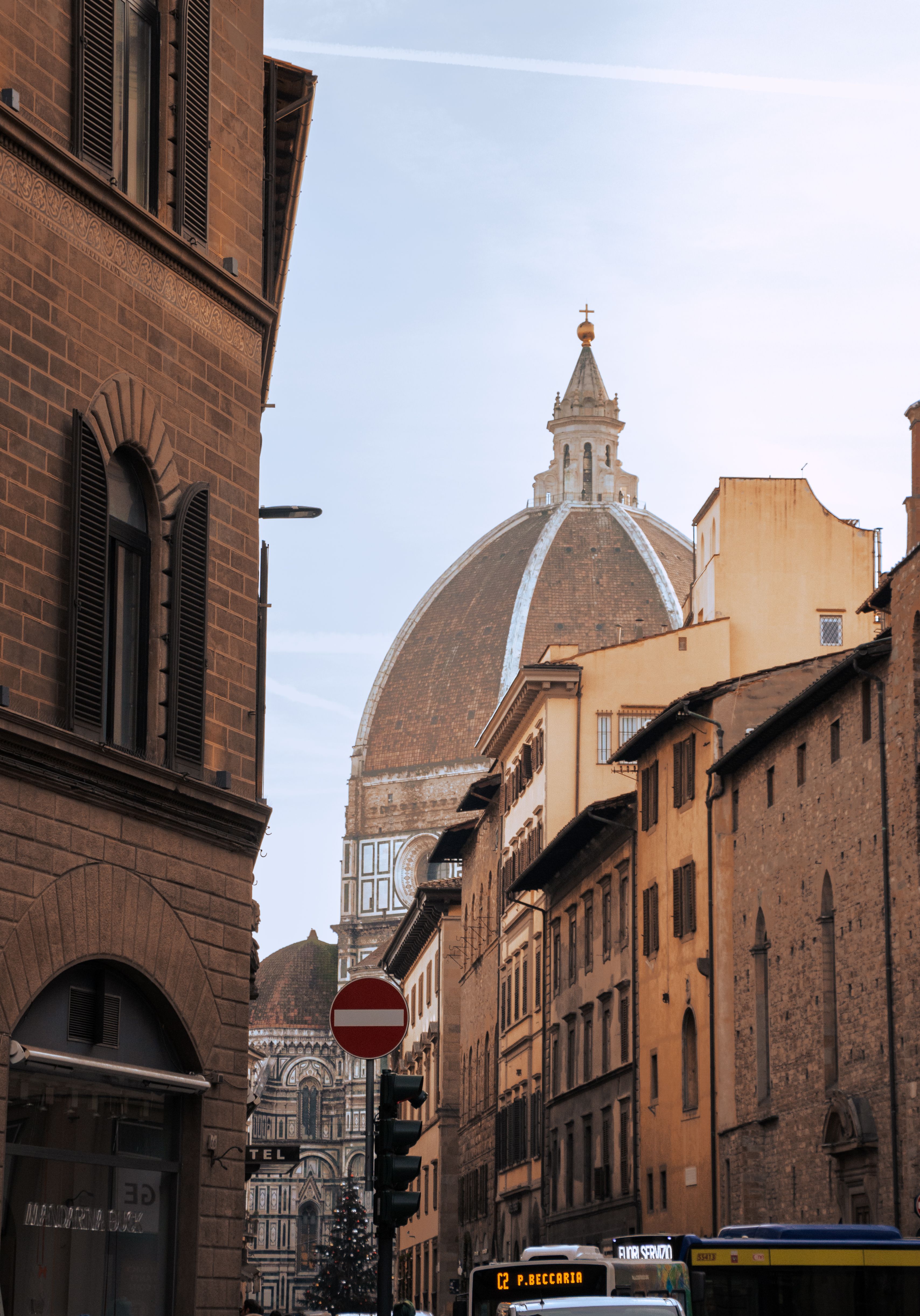 Street view of Florence with a focus on the iconic Duomo dome, capturing city architecture.