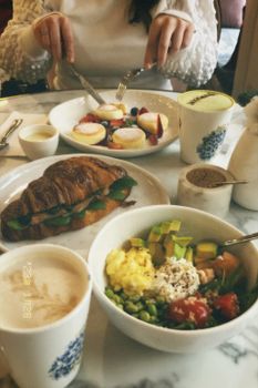 Delightful brunch meal with vibrant dishes and pastries on a cozy dining table.