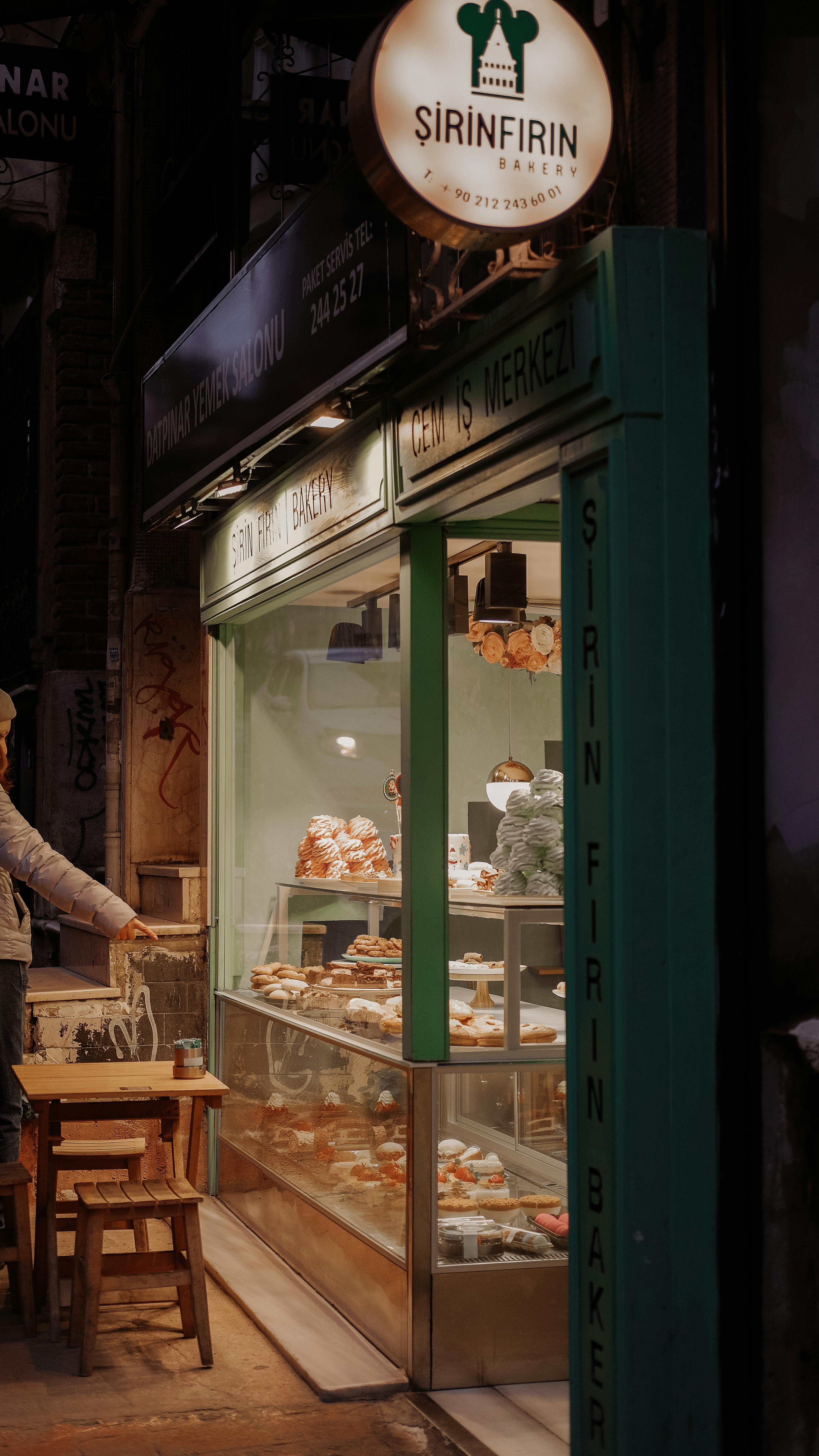 Warm, inviting night view of a street bakery in Turkey, showcasing pastries.